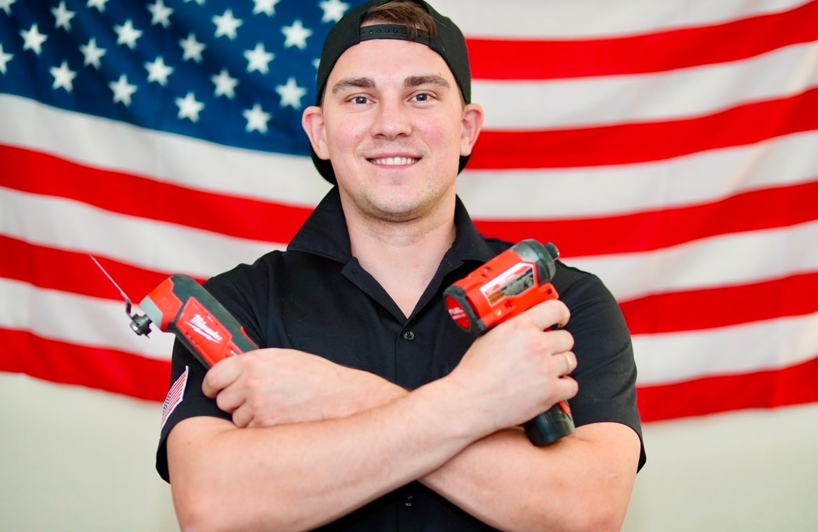 Service technician holding repair tools